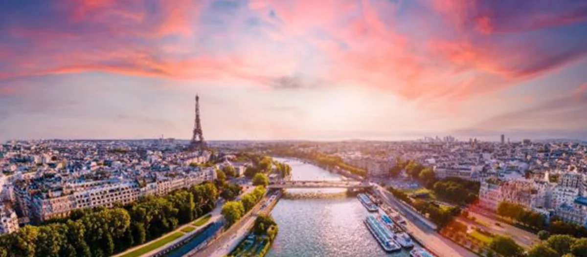 Paris skyline overlooking The Seine River with the Eiffel Tower in the background.